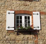 Traditional timber windows with shutters