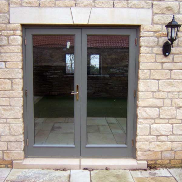 Grey timber french doors leading onto patio