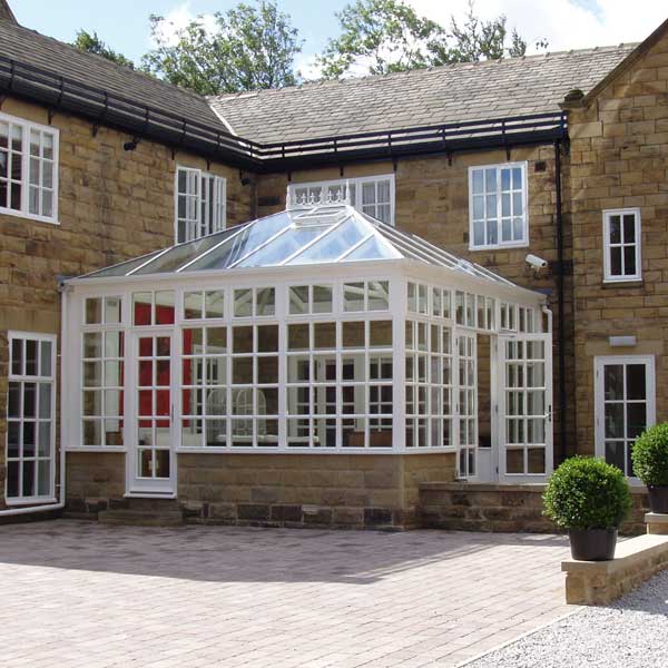 A white timber conservatory with georgian bars