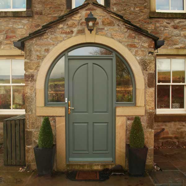 Timber entrance door installed on a traditional property